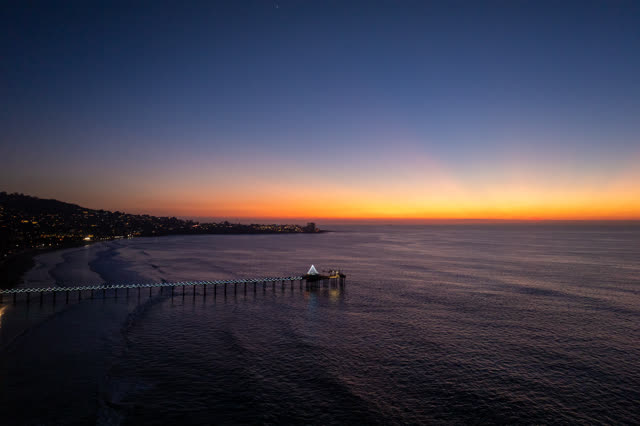 Aerial view of the beach, the pier and the ocean at La Jolla Shores.