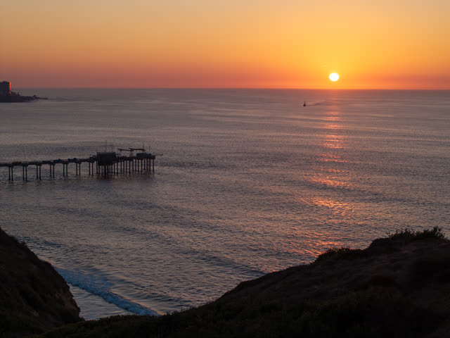 Elevated view of the cliffs, the pier and the ocean at La Jolla Shores.