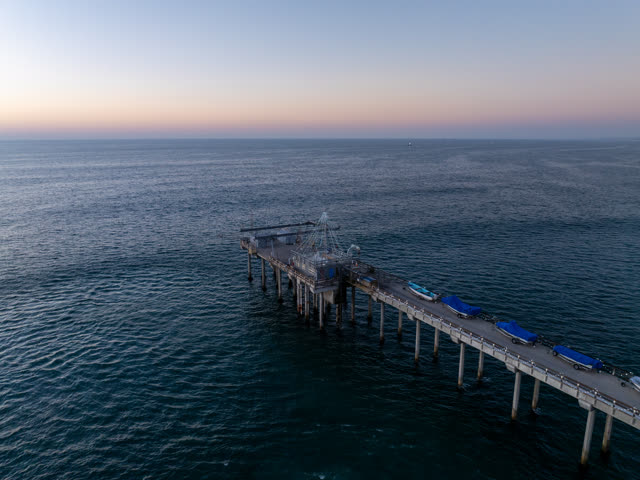 Aerial view of the beach, the pier and the ocean at La Jolla Shores.