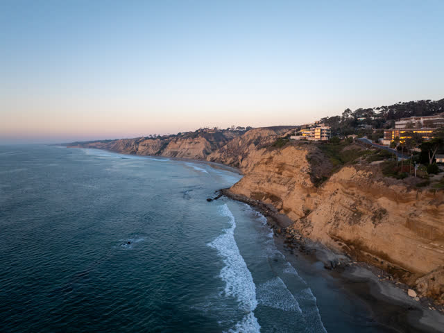 Aerial view of the cliffs, the surf and the ocean at La Jolla Shores.