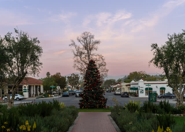Photo of the Christmas tree at the Inn at Rancho Santa Fe captured during a beautiful twilight evening showcasing festive lights elegant architecture and classic holiday atmosphere | Photo – 1
