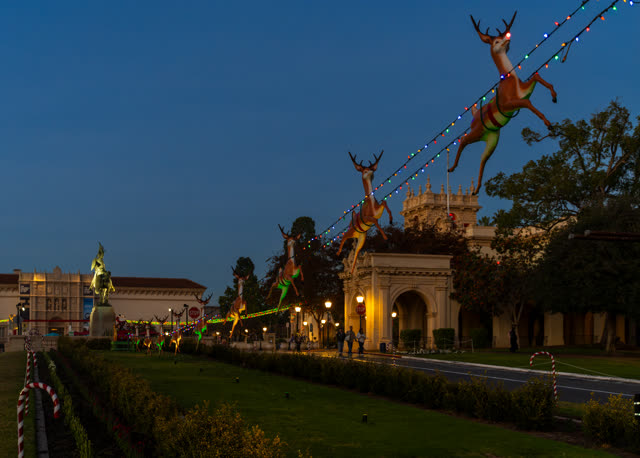 A park, the buildings and open country in Balboa Park, with people walking.
