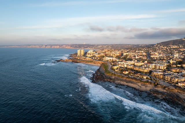 Aerial view of the beach, the surf and the ocean at La Jolla Cove.