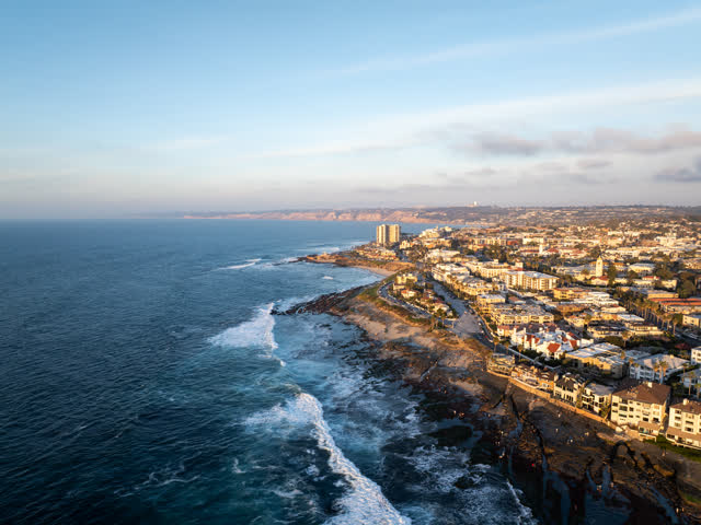 Aerial view of the cliffs, the surf and the ocean at La Jolla Cove.