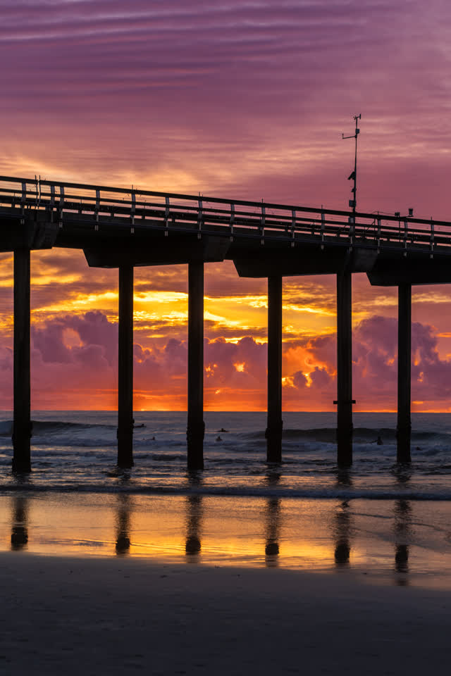 Evening sunset photo at Scripps Pier in La Jolla Shores San Diego California showcasing dramatic light ocean texture and classic coastal landmark | Photo – 51
