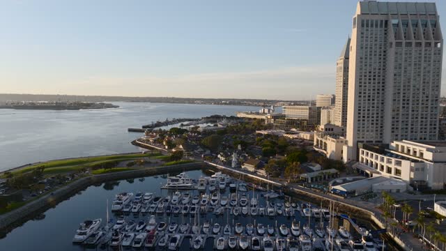 Aerial view of the harbor, the skyline and boats at Marina, with boats out.