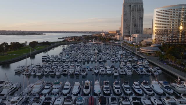 Aerial view of the harbor, the skyline and boats at Marina, with boats out.