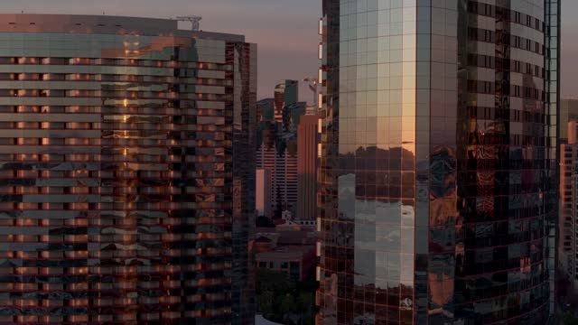 Low aerial view of the downtown streets, the skyline and the buildings at Marina.