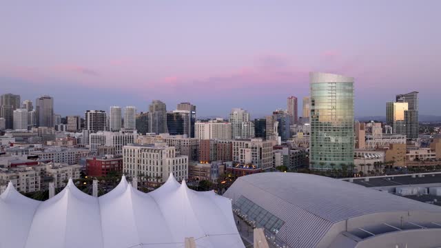 Low aerial view of the downtown streets, the skyline and the buildings at Gaslamp.