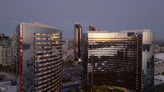 Low aerial view of the downtown streets, the skyline and the buildings at Marina.