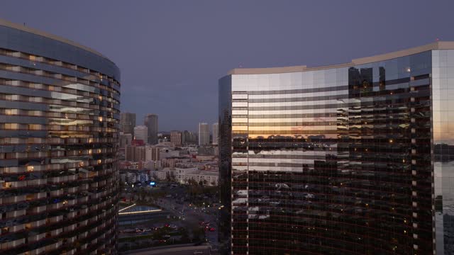 Low aerial view of the downtown streets, the skyline and the buildings at Marina.