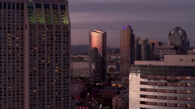Low aerial view of the downtown streets, the skyline and the buildings at Embarcadero.