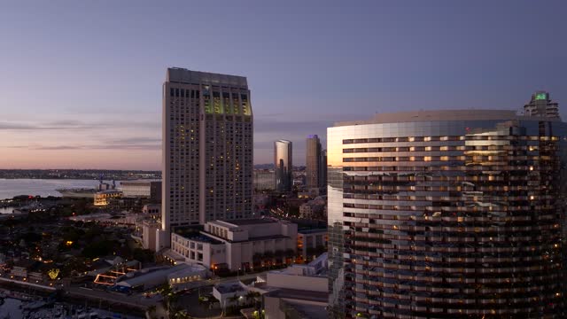 Low aerial view of the downtown streets, the skyline and the bay at Marina.
