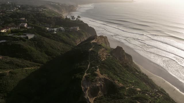 Aerial view of the cliffs, the ocean and homes at Black’s Beach.