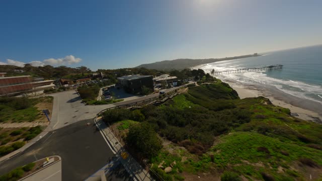 Aerial view of the cliffs, the pier and the ocean at La Jolla Shores.