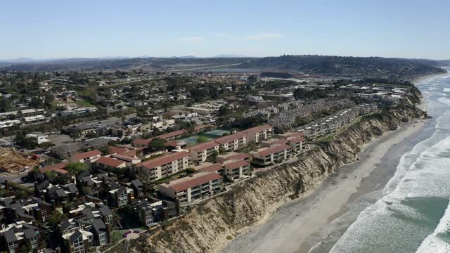 Aerial view of the cliffs, the surf and the ocean in Solana Beach.