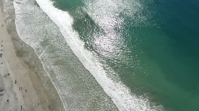 Aerial view of the beach, the surf and the ocean in Solana Beach.