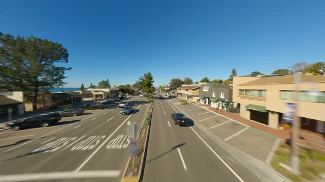 Low aerial view of the downtown streets, the buildings and the city in Del Mar.