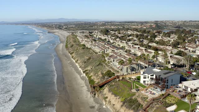Aerial view of the beach, the surf and palm trees at Leucadia.