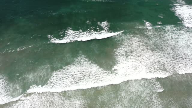 Aerial view of the beach, the surf and the ocean at Leucadia.