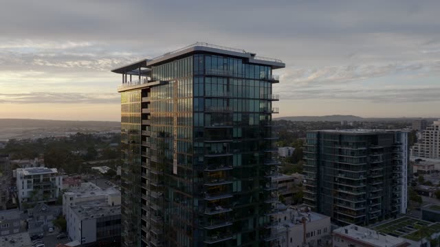 Low aerial view of the downtown streets, the skyline and homes at Bankers Hill.