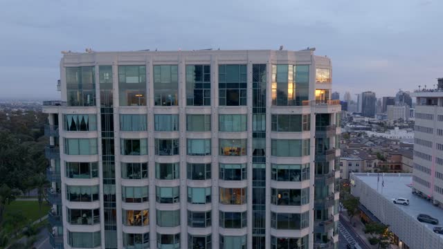 Low aerial view of the downtown streets, the skyline and homes at Bankers Hill.