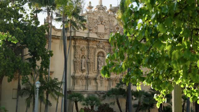 A park, palm trees and the buildings in Balboa Park.