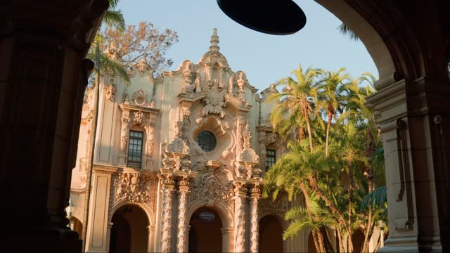 A park, palm trees and the buildings in Balboa Park.