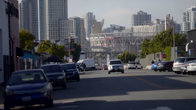 The downtown streets, the skyline and the buildings in Barrio Logan, with people walking.