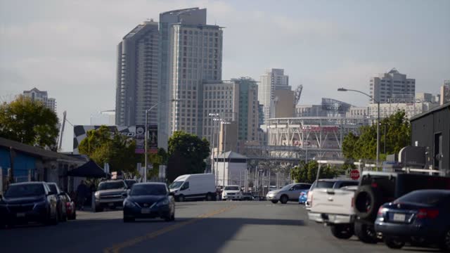 The downtown streets, the skyline and the buildings in Barrio Logan, with people walking.