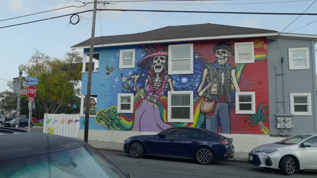 A residential street, homes and the buildings in Barrio Logan.