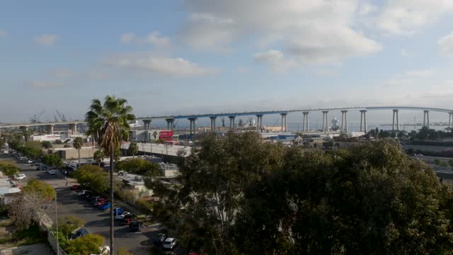 Low aerial view of the harbor, the bridge and boats in Barrio Logan.
