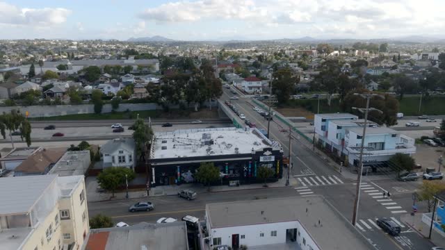 Aerial view of a residential street, homes and the buildings in Barrio Logan.