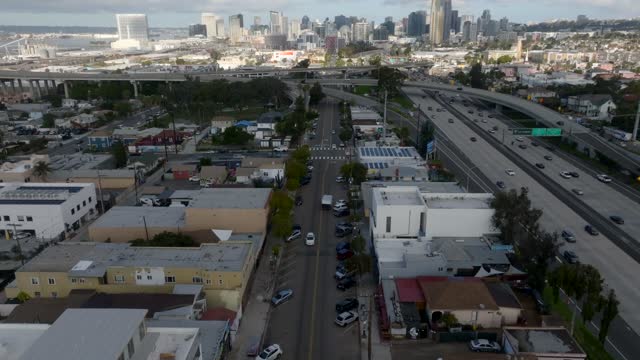 Aerial view of the downtown streets, the skyline and homes in Barrio Logan.