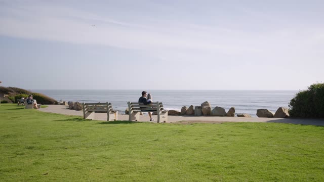 A couple enjoying a beautiful day at Calumet Park in Bird Rock La Jolla | Video