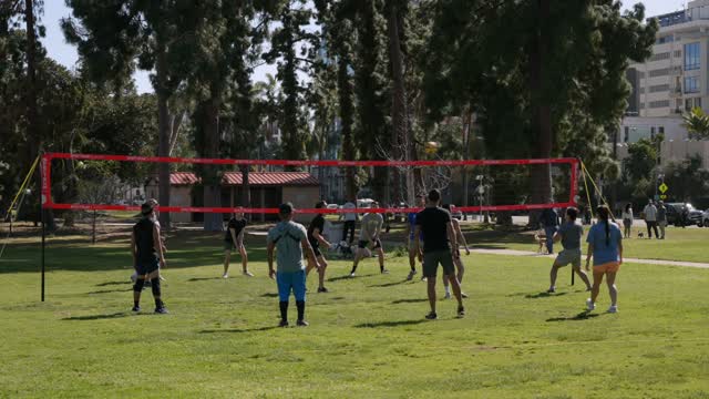 A park and open country in Balboa Park, with a crowd gathered.