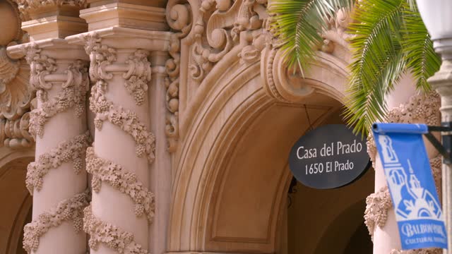 Close view of a park, palm trees and the buildings in Balboa Park.