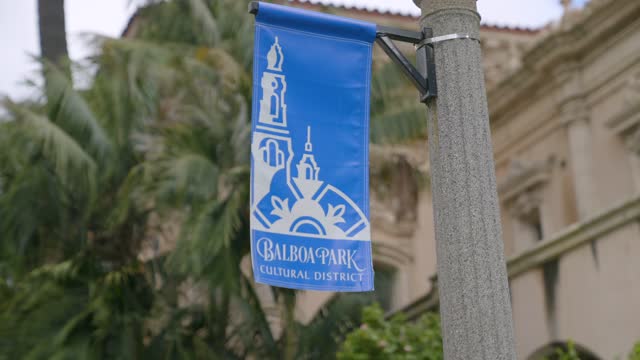 Close view of a park, palm trees and the buildings in Balboa Park.