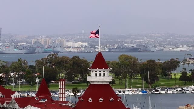 Low aerial view of the harbor, boats and the bay at Coronado Beach.