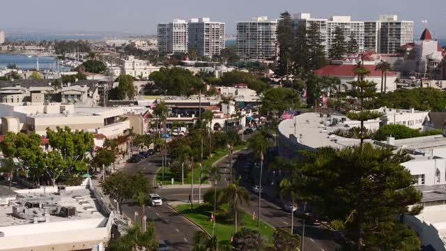 Low aerial view of the downtown streets, boats and palm trees in Coronado.