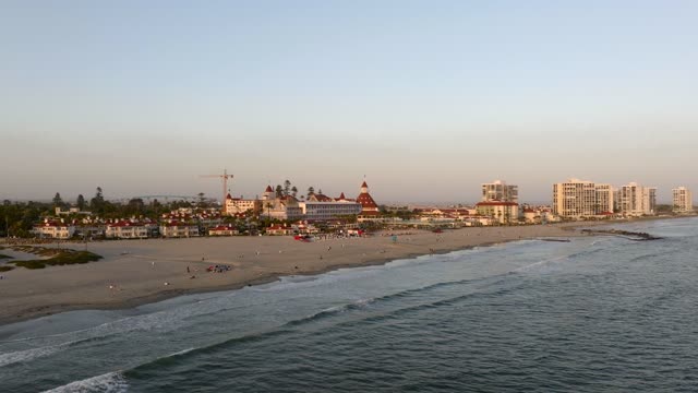 The Hotel Del Coronado at Coronado Beach during Sunset and Twilight in San Diego | Drone Video