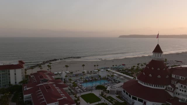 Aerial view of the beach, palm trees and the ocean at Coronado Beach.