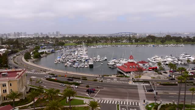 Aerial view of the harbor, the bridge and the skyline at Coronado Beach, with boats out.