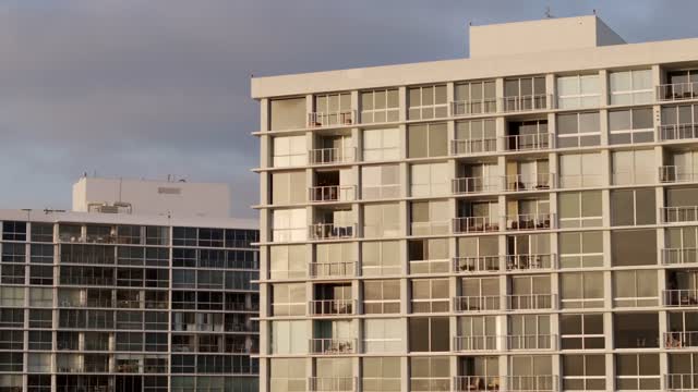 A residential street, homes and the buildings at Coronado Beach.
