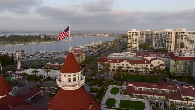 Low aerial view of the beach, boats and the bay at Coronado Beach.