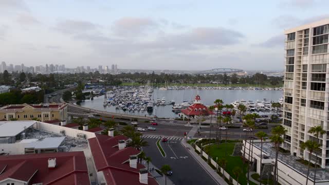 Low aerial view of the harbor, the bridge and the skyline at Coronado Beach.