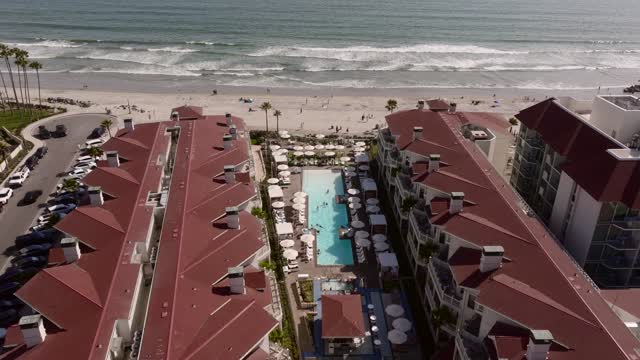 Aerial view of the beach, the surf and the pier at Coronado Beach.