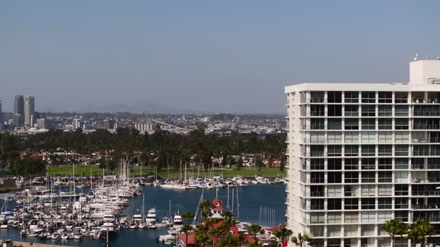Low aerial view of the harbor, the skyline and boats at Coronado Beach.