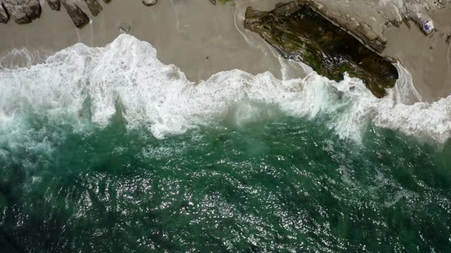 Aerial view of the beach, the surf and the ocean at Windansea.