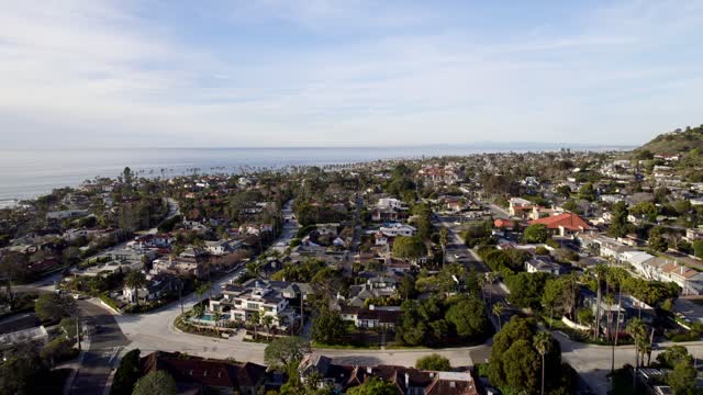 Aerial view of a residential street, palm trees and the ocean at Bird Rock.